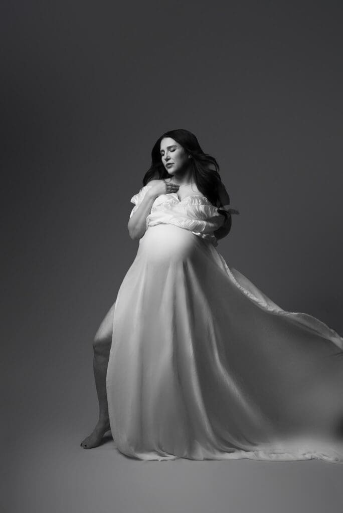 stunning mom with white dress on black and white image columbus ohio
