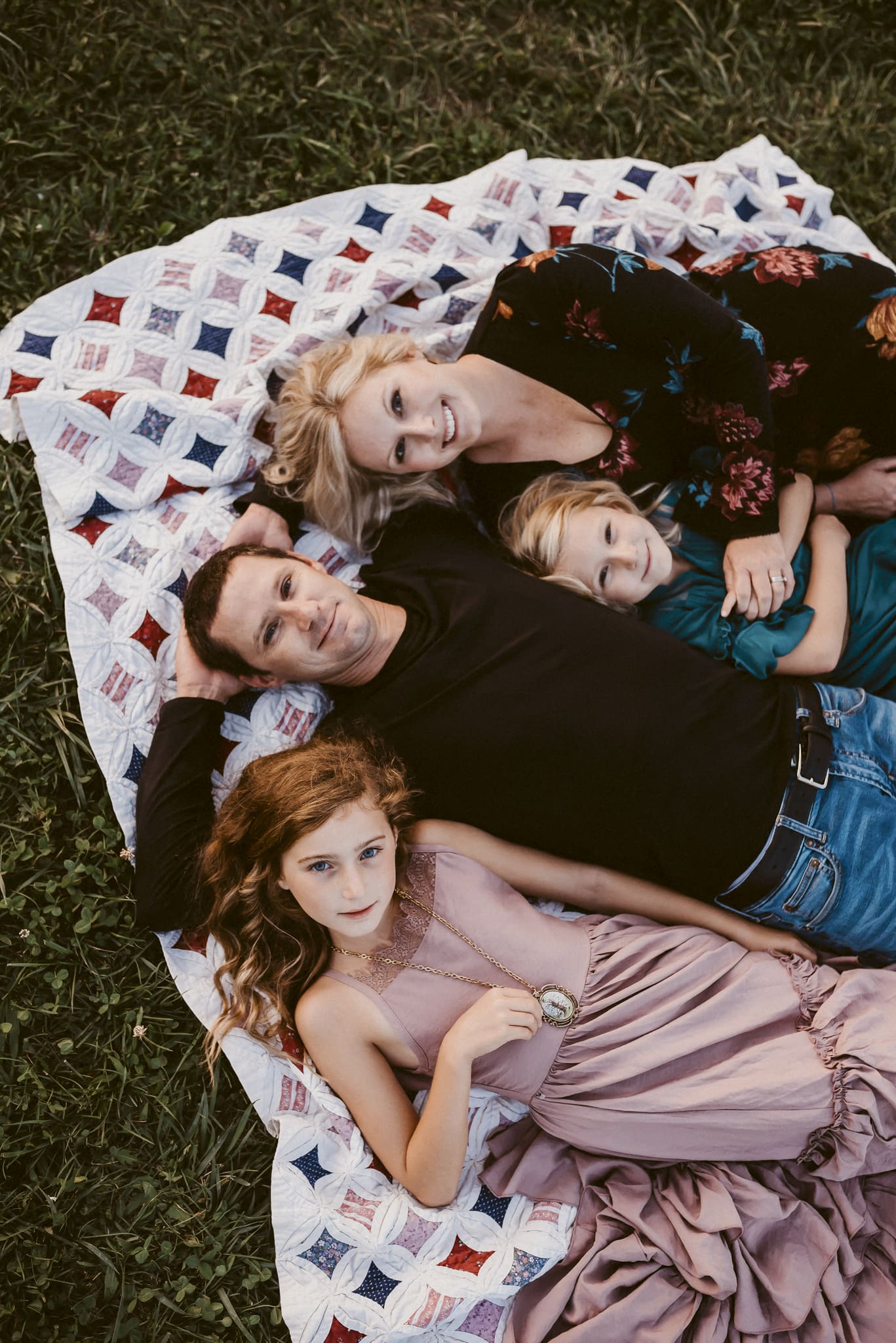 columbus ohio family photographer family of four laying on their backs looking up at the camera