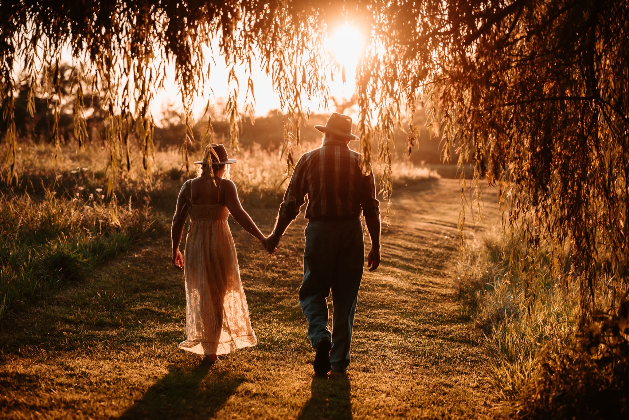 Grandma and grandpa walking holding hand in the sunset walking