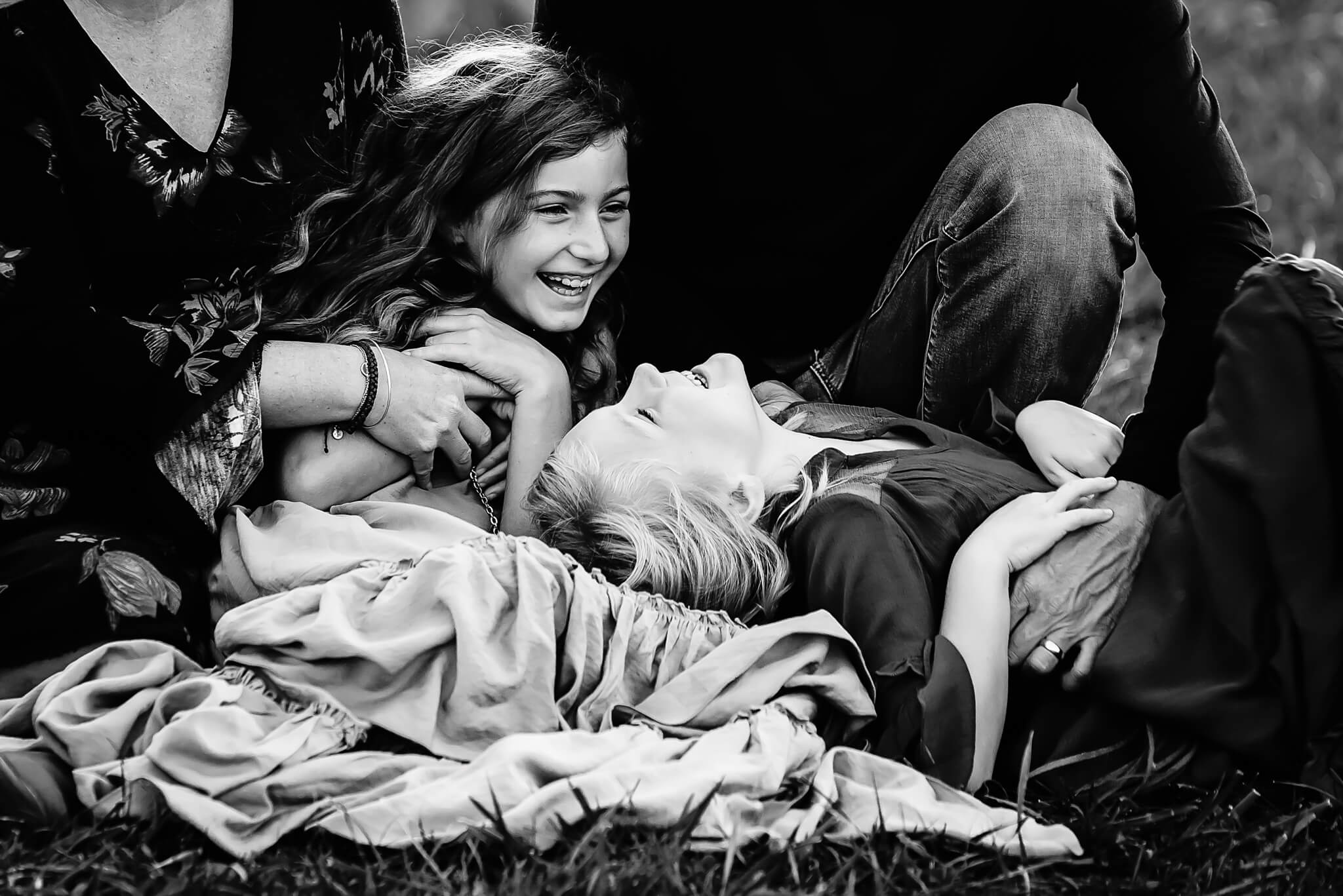 black and white image of the two sister laughing together