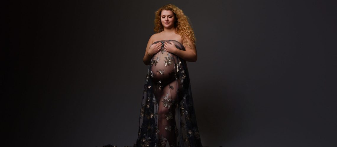columbus ohio photo studio captures a maternity image with a woman in a sheer draping